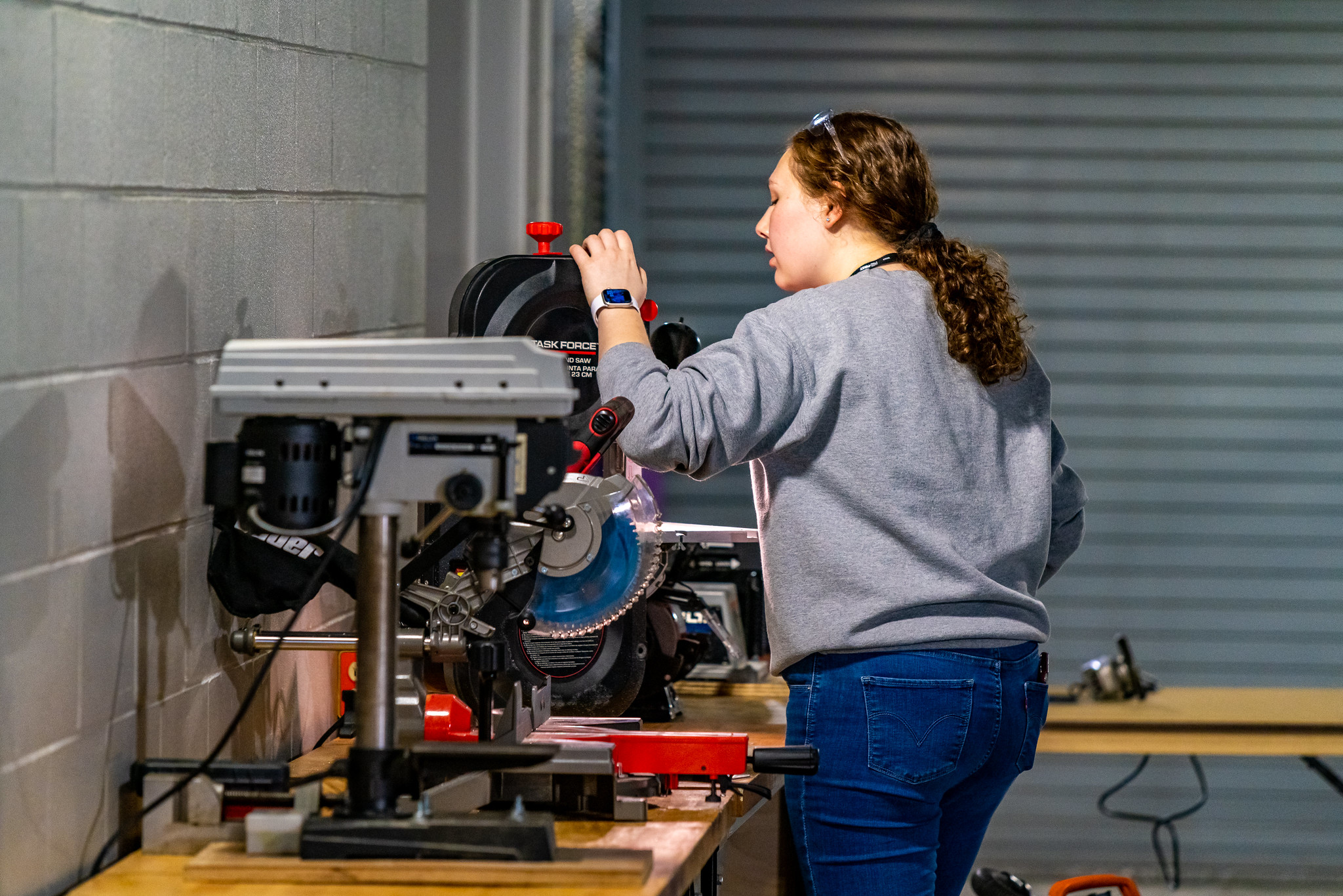 Applied Engineering and Technical Management Student volunteering in the Iowa Regional Machine Shop, which aids teams when a robot part breaks.