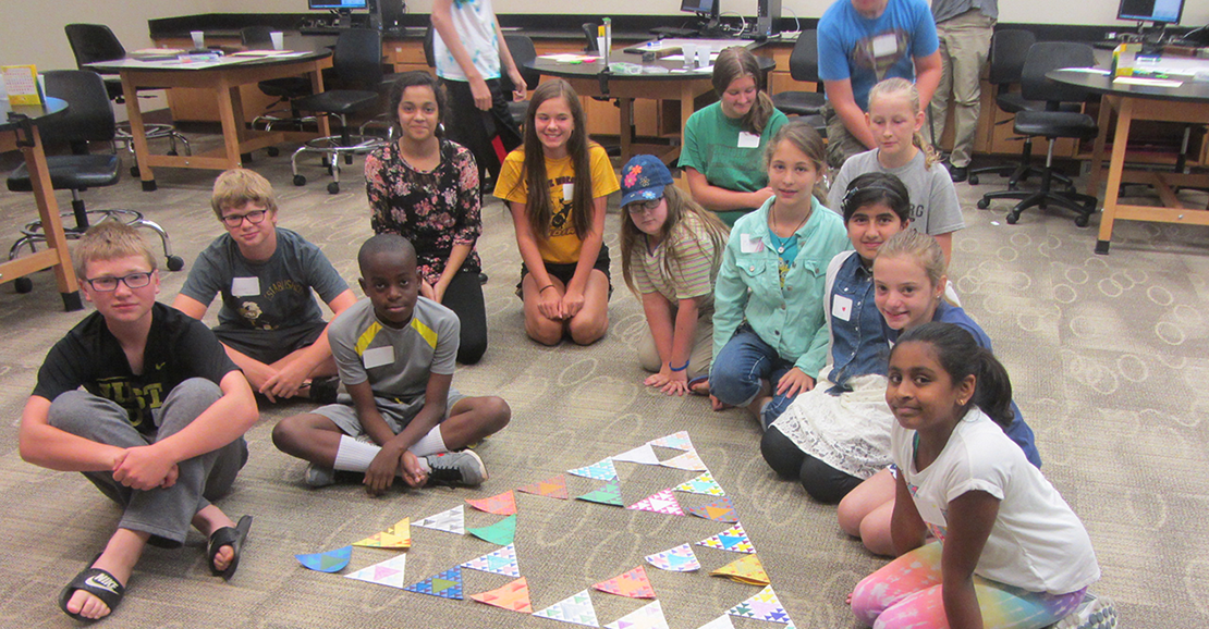 Beyond Frozen campers and their sierpinski triangle fractal art project.